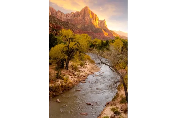 Cramer Imaging's professional quality landscape photograph of the Virgin River and mountains at sunset in Zion's National Park, Utah