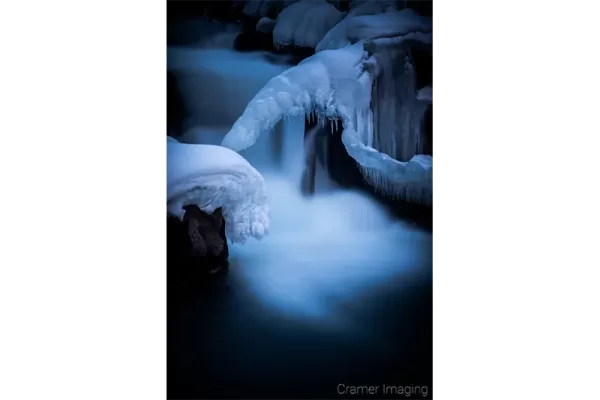 Cramer Imaging's nature photograph of a silky waterfall in the snow during winter in Idaho Falls, Idaho
