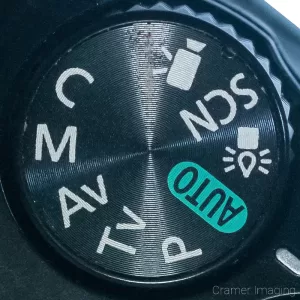 Cramer Imaging's close-up photograph of a Canon DSLR camera settings dial