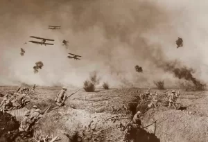 Picture of soldiers in the trenches and biplanes bombing overhead taken by Australian photographer Frank Hurley during World War I