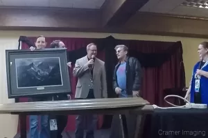 Audrey displaying Cramer Imaging's gift to Paul Michael Glaser at the Snake River Comic Con 2017