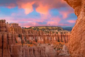 Cramer Imaging's fine art landscape photograph of fiery orange clouds lighting up over the Boat Mesa in Bryce Canyon National Park Utah