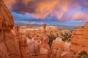 Cramer Imaging's fine art landscape photograph of fiery orange clouds lighting up Thor's Hammer in Bryce Canyon National Park Utah