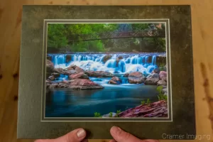 Cramer Imaging's photograph of a man holding a matted copy of "Untouched" as a memory