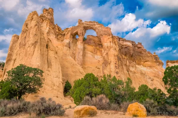 Fine art landscape photograph of the Grosvenor double arch with dramatic sky of Escalante National Monument Utah by Cramer Imaging