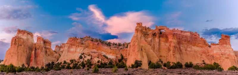 Cramer Imaging's fine art landscape panorama photograph of the Kaiparowiets plateau featuring Grosvenor Arch in Escalante National Monument Utah at sunset