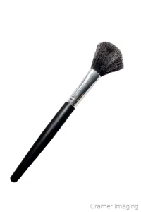 Cramer Imaging's photograph of a soft-bristled make-up brush with black handle on white background