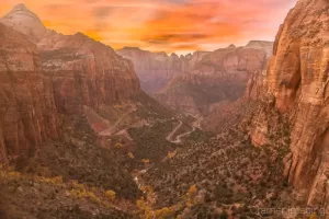 Cramer Imaging's fine art landscape photograph of a golden sunset over the Canyon Overlook trail view in Zion's National Park Utah