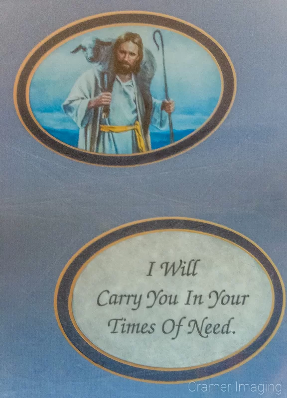 Audrey Cramer Photography's photograph of a religious picture and a saying in a double circular double layer blue mat