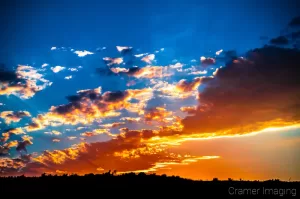 Cramer Imaging's professional quality nature cloudscape photograph of a colorful sunset lighting up clouds