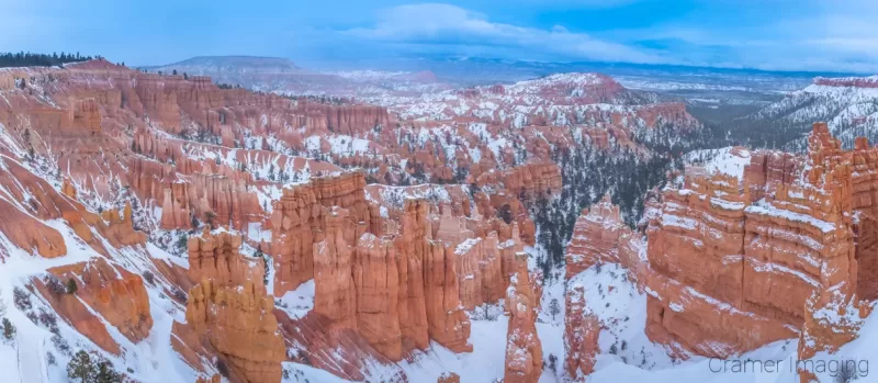 Cramer Imaging's fine art landscape panorama photograph of a winter storm brewing over snowy Bryce Canyon National Park Utah