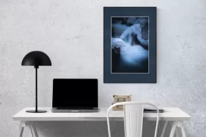 Photograph of Cramer Imaging's landscape photo titled "Ice Castle" in an office or home office setting