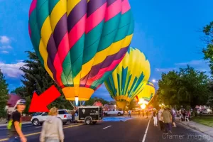 Graphic showing a photograph of hot air balloons in the street and an attempted photo bomber