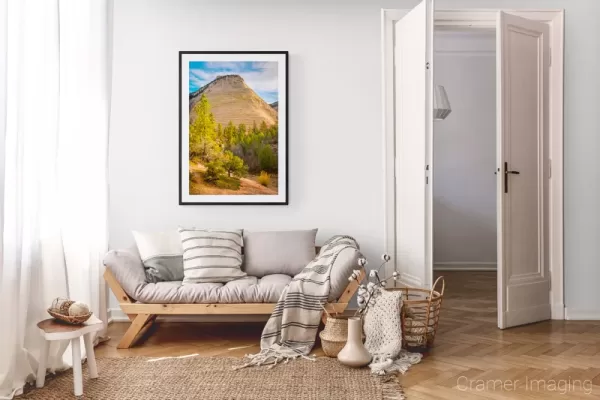 Photograph of Cramer Imaging's landscape photo "Checkerboard Mesa in Autumn" in a cozy neutral-toned living room