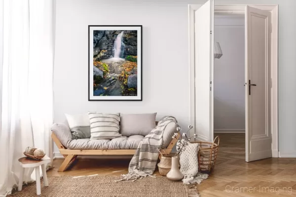 Photograph of Cramer Imaging's landscape photo "Fall Waterfall" in a cozy neutral-toned living room