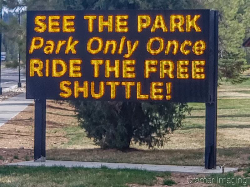 Photograph of a digital sign advertising the Bryce Canyon Shuttle service