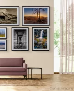 Photograph of several Cramer Imaging landscape photos displayed on a gallery wall eclectic style