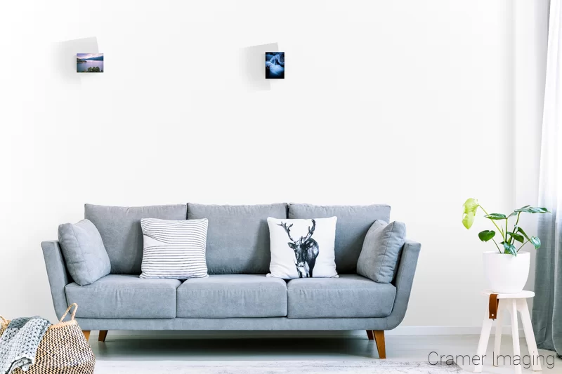 Image of a couple 5x7 landscape photo prints on the wall of a lounge