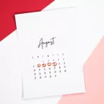 Calendar of the month of August with 4 dates circled on a colored background