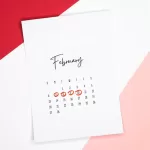 Calendar of the month of February with 4 dates circled on a colored background