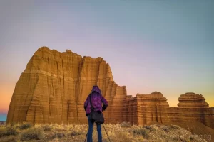 Professional landscape photographer Audrey Cramer photographing the Temple of the Sun in Cathedral Valley at sunset