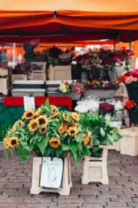 Photo of a farmers' market stall selling fresh cut flowers