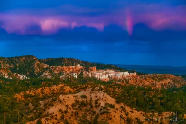 Cramer Imaging's fine art landscape photograph of a rainbow above the lookout at Bryce Canyon National Park Utah
