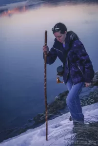 Photograph of Audrey of Cramer Imaging climbing up a snowy slope in the winter