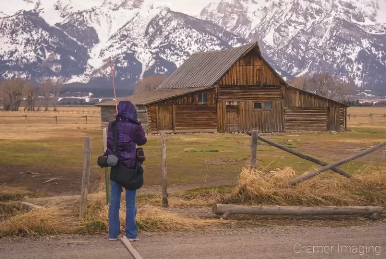 Cramer Imaging's photograph of landscape photographer Audrey Cramer taking a Moulton Barn picture at Grand Teton National Park Wyoming