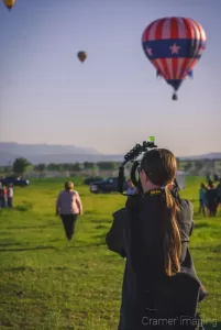 Professional photographer Audrey Cramer taking photos of hot air balloons in Panguitch, Utah