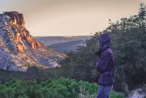 Behind-the-scenes photograph of photographer Audrey Cramer scouting out a shot at Kolob Canyon Zion National Park Utah