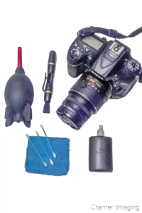 Cramer Imaging's photograph of a camera and camera cleaning kit on a white background