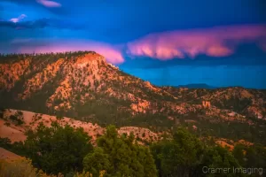 Cramer Imaging's fine art landscape photograph of cotton candy pink clouds over the lookout point at Bryce Canyon National Park Utah