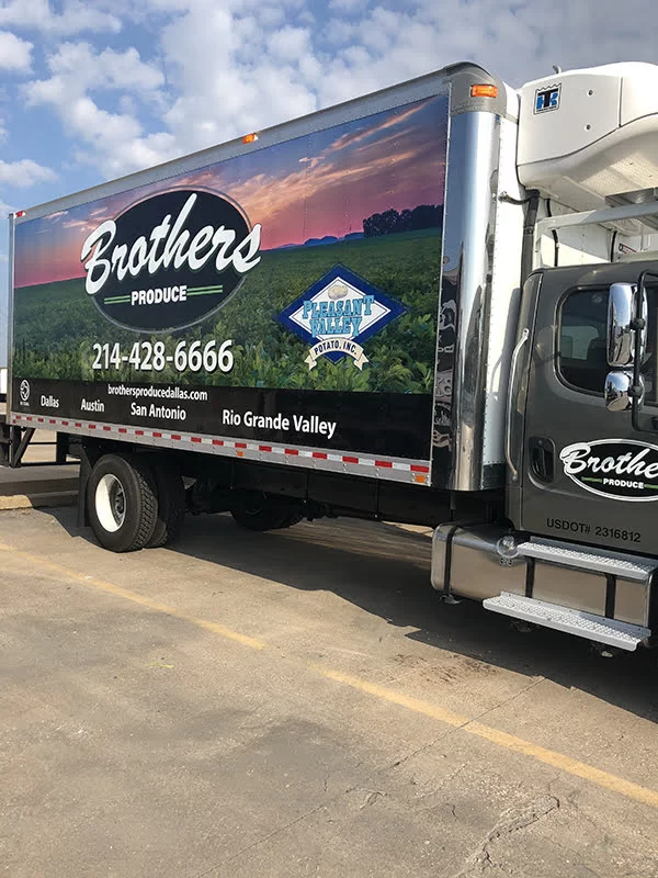 Photograph of Cramer Imaging's potato field at sunrise photo on a Brothers Produce semi truck