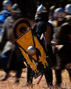 Action photograph of heavy fighters in armor from the SCA in Mantua, Utah by Cramer Imaging