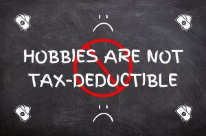 Graphic saying 'hobbies are not tax-deductible" with money, a no sign, and sad faces