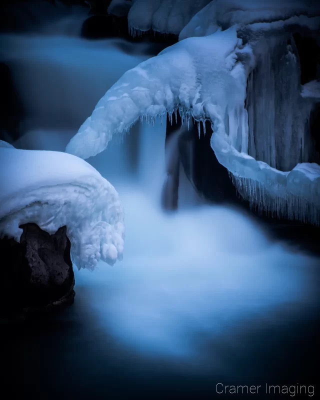 Cramer Imaging's nature photograph of a silky waterfall in the snow during winter in Idaho Falls, Idaho