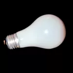 Photograph of a single incandescent light bulb on its side on a black background by Cramer Imaging