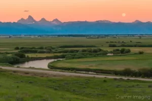 Cramer Imaging's professional quality landscape photograph of the Teton mountains and river at moon rising in Tetonia, Teton, Idaho