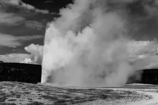 Cramer Imaging's black and white landscape photograph of Old Faithful geyser at Yellowstone National Park, Wyoming