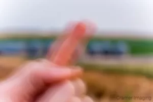 Cramer Imaging's photograph of a single finger opening up a panorama series of landscape photos