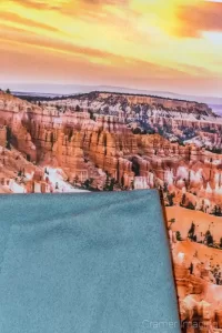 Photograph of a desert landscape photo print and a piece of microfiber cloth for removing fingerprints by Cramer Imaging