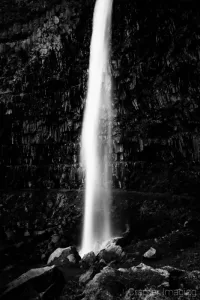 Cramer Imaging's fine art landscape black and white or monochromatic photograph of a soft and silky waterfall cascading down in Twin Falls Idaho