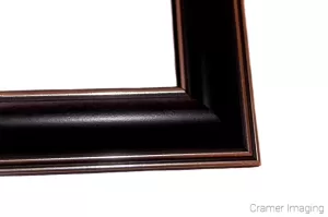 Cramer Imaging's photograph of a single navy blue colored plastic picture frame corner on a white background