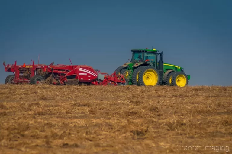 Cramer Imaging's commercial landscape photograph of a tractor harvesting in a field