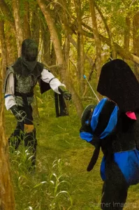 Action sports photograph of two medieval rapier fighters in a forest in Mantua, Utah by Cramer Imaging