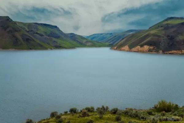Cramer Imaging's quality landscape photograph of Ririe Reservoir with cloudy skies and choppy lake water in Idaho