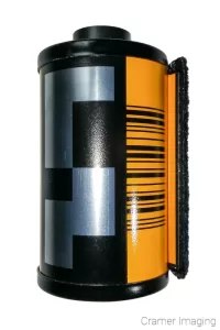 Cramer Imaging's stock photograph of a classic roll of camera film or roll of film on a white background