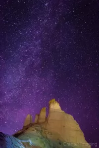 Fine Art landscape photograph of the Milky Way shines over a rock formation at night in Utah by Cramer Imaging