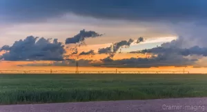 Cramer Imaging's fine art nature photograph of sunset and clouds after a storm in a farm field in Pocatello, Idaho